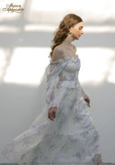 Floral tiered midi dress with square neckline and long sheer puff sleeves