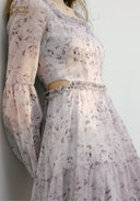 Lilac floral midi dress back close-up showing gathered waist and tiered skirt panels