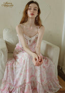 Light pink floral dress with lace-trim neckline, thin spaghetti straps, tiered ruffle hem