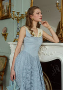Light blue sleeveless lace patchwork dress with V-neck and textured lace hem