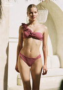 Pink asymmetrical bikini set with ruffled one-shoulder top and high-cut briefs