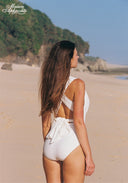 Ivory one-piece swimsuit showing open back and tied waist detail