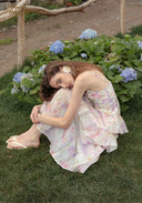 Parfum de Thé dress with spaghetti straps and layered pastel floral ruffles, tiered hem