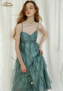 Teal satin midi dress with ruched bust and spaghetti straps, close-up bodice