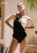 One-shoulder rosette swimsuit in black and white, fitted with high-cut leg