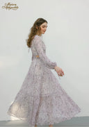 Lilac floral midi dress with long sleeves and flared tiered skirt, side view
