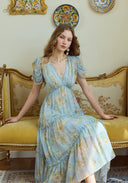 Light blue floral tiered midi dress with puff sleeves and V-neck