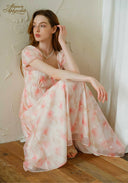 Sunset dress in light pink floral print with puff sleeves and square neckline, maxi length