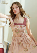 Pink linen maxi dress with burgundy trim, gathered waist, and floral embroidery