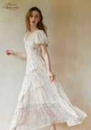 Floral tiered maxi dress with puff sleeves and flowing ruffled skirt, cinched waist