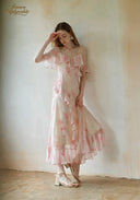 Light pink floral maxi dress with off-shoulder ruffle sleeves and tiered skirt