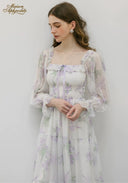 Floral smocked bodice tiered midi dress with sheer puff sleeves and gathered skirt