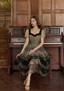 Lace mesh midi dress with dark lace square neckline, puff sleeves, and tiered scalloped skirt