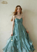Teal satin midi dress with ruched bodice and spaghetti straps, full skirt flare