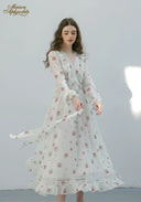 Floral midi dress with long sleeves and gathered tiered skirt