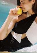 Halter contrast swimsuit with black and white cutout panels