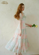 Pastel floral tiered midi dress with short puff sleeves and square neckline