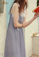 Blue patterned midi dress with lace-trim bodice and hanging ribbon ties at shoulder