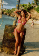 Pink bikini set with triangle top and tie side briefs, ruffle details