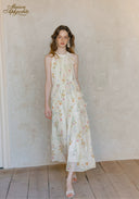 Floral sleeveless midi dress with flowy gathered skirt and round neckline, full-length all-over print