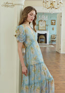 Light blue floral midi dress with puff sleeves and tiered skirt