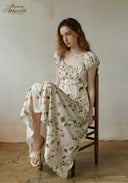 Floral dress with round neckline, puff sleeves, and draped full skirt, white base