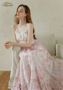 Light pink floral lace-trim slip dress with spaghetti straps and layered tiered skirt ruffles