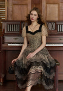 Lace mesh midi dress with dark lace neckline trim, puff sleeves, and layered lace skirt