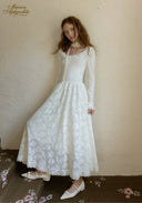 White lace ballet journal dress with long sleeves and gathered full skirt in back view