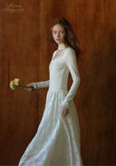 White lace ballet journal dress with off-shoulder neckline and long sleeves, side view