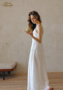 White lace-trim midi dress with spaghetti straps and lightly patterned skirt fabric