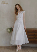 White lace midi dress with ruffled cap sleeves, gathered waist, flared skirt