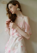 Light pink floral maxi dress with off-shoulder ruffle sleeves and spaghetti straps