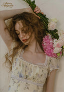 Floral tea dress with square neckline and ruched lace trim at the shoulders