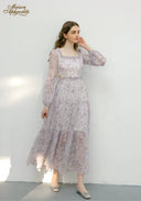 Lilac floral midi dress with square neckline, long sleeves, cinched waist and tiered hem