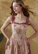 Pink linen maxi dress with burgundy square neckline and floral embroidery detail