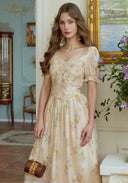 Cream floral midi dress with puff sleeves, cinched waist, and full gathered skirt