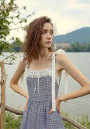 Blue patterned midi dress with lace-trim square neckline and bow-tie straps