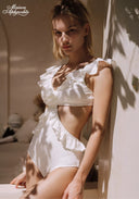 White ruffle bikini swimsuit with V neckline and layered shoulder accents