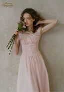 Pale pink dotted midi dress with buttoned lace bodice and ruffled neckline