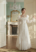 Ivory tiered lace dress with off-shoulder ruffles and long puff sleeves