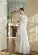 Ivory tiered lace dress with ruffle neckline and cascading layered skirt