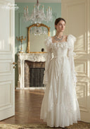 Ivory tiered lace dress with off-shoulder ruffles and long puff sleeves