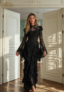 Black lace evening gown with long sleeves and layered ruffle skirt