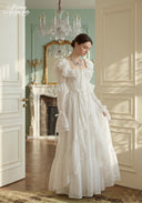 Ivory tiered lace dress with ruffled neckline and gathered tiered skirt